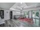 Basement living room with recessed ceilings, a gray sectional, and gray and red rug at 463 Lake Wylie Rd, Belmont, NC 28012