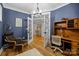 Well-appointed office with hardwood floors, french doors, and custom built-in shelving at 463 Lake Wylie Rd, Belmont, NC 28012