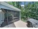 Inviting screened porch with serene views of the backyard and surrounding greenery at 463 Lake Wylie Rd, Belmont, NC 28012