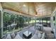 Relaxing screened porch overlooking a tranquil wooded area and serene lake view at 463 Lake Wylie Rd, Belmont, NC 28012