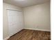 Bedroom featuring wood floors and a large closet at 4805 Horizon Cir, Charlotte, NC 28215