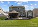 Backyard featuring a gazebo with outdoor seating and a well-maintained lawn at 5813 Mcclintock Dr, Denver, NC 28037