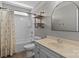 Modern bathroom with decorative shelves, a tub-shower combo, and a stylish vanity at 5813 Mcclintock Dr, Denver, NC 28037