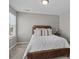Bedroom with neutral walls and carpeted floor; ample natural light from window at 5813 Mcclintock Dr, Denver, NC 28037