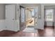 Bright and airy foyer features a decorative glass front door and leads into the home's interior at 5813 Mcclintock Dr, Denver, NC 28037