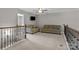 Cozy loft area with plush sofas, a mounted TV, and a ceiling fan at 5813 Mcclintock Dr, Denver, NC 28037