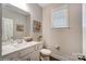 Well-lit bathroom with modern vanity, white marble countertop, and decorative artwork at 6282 Tea Olive Dr # Lot 236, Harrisburg, NC 28075