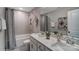 Well-lit bathroom with double vanity, tile accents, and stylish decor at 6282 Tea Olive Dr # Lot 236, Harrisburg, NC 28075