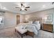 This spacious bedroom features a ceiling fan and ample natural light at 6282 Tea Olive Dr # Lot 236, Harrisburg, NC 28075