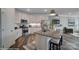 Modern kitchen with stainless steel appliances, island with seating, and stylish countertops at 6282 Tea Olive Dr # Lot 236, Harrisburg, NC 28075
