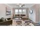 Cozy living room featuring neutral colors, a comfortable sofa, and plenty of natural light at 6282 Tea Olive Dr # Lot 236, Harrisburg, NC 28075