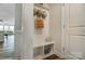 Functional mudroom area with built-in bench, storage cubbies, and coat hooks at 6282 Tea Olive Dr # Lot 236, Harrisburg, NC 28075