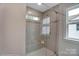 Modern tiled shower with glass door and window for natural light at 6282 Tea Olive Dr # Lot 236, Harrisburg, NC 28075
