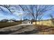 Spacious backyard featuring a newly installed fence and a concrete driveway at 702 E Grover St, Shelby, NC 28150