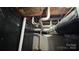 The basement reveals open ceilings with visible ductwork and utilities at 702 E Grover St, Shelby, NC 28150
