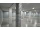 Finished basement featuring painted concrete floors, painted brick columns, and recessed lighting at 702 E Grover St, Shelby, NC 28150