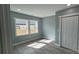 Light-filled bedroom featuring hardwood floors, recessed lighting, and a double-door closet at 702 E Grover St, Shelby, NC 28150