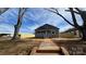 Charming single-story home with a front porch, freshly painted exterior, and a newly installed fence at 702 E Grover St, Shelby, NC 28150