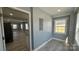 Bright laundry room with a window and new tile flooring at 702 E Grover St, Shelby, NC 28150