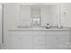 Bright bathroom with granite counters, white cabinets, and dual sinks at 758 Latrobe Dr, Iron Station, NC 28080