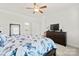 Bright bedroom features a ceiling fan, a window, and light gray walls at 758 Latrobe Dr, Iron Station, NC 28080
