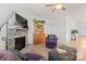 Inviting living room features a stone fireplace, hardwood floors, and comfortable seating at 758 Latrobe Dr, Iron Station, NC 28080