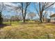 Expansive backyard space with mature trees and access to the home's back porch at 839 Oak Grove Rd, Kings Mountain, NC 28086