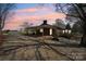 Exterior view of a home featuring a covered carport and gravel landscaping at 839 Oak Grove Rd, Kings Mountain, NC 28086