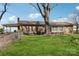 Spacious backyard featuring well-maintained lawn, mature tree, and exterior of home at 839 Oak Grove Rd, Kings Mountain, NC 28086