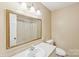 Well-lit bathroom features a large mirror, vanity, and combined shower and tub at 839 Oak Grove Rd, Kings Mountain, NC 28086