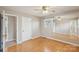 This bedroom features hardwood floors, a ceiling fan, a mirrored wall and a closet at 839 Oak Grove Rd, Kings Mountain, NC 28086
