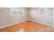 This bedroom features hardwood floors and two bright windows at 839 Oak Grove Rd, Kings Mountain, NC 28086