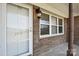This image shows the front door with a large front window and exterior lantern at 839 Oak Grove Rd, Kings Mountain, NC 28086
