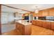 Traditional kitchen with wood cabinets, black appliances, and a view into another room at 839 Oak Grove Rd, Kings Mountain, NC 28086