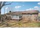 Rear exterior of brick home with deck, enclosed porch, and mature trees at 839 Oak Grove Rd, Kings Mountain, NC 28086