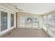 This sun room features bright windows, doors, and a ceiling fan at 839 Oak Grove Rd, Kings Mountain, NC 28086
