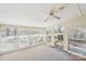This sun room features bright windows and a ceiling fan at 839 Oak Grove Rd, Kings Mountain, NC 28086