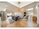 Spacious open-concept living space with kitchen island, vaulted ceiling, fireplace, and lots of natural light at 8911 St Croix Ln, Charlotte, NC 28277