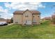 Home's back exterior features a deck, yard space, and traditional siding at 9391 Leyton Dr, Harrisburg, NC 28075