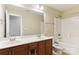 Bathroom featuring a double vanity, a shower-tub combo, and wood cabinets at 9391 Leyton Dr, Harrisburg, NC 28075