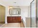 Bathroom featuring double sink vanity, large mirror, soaking tub and walk-in shower at 9391 Leyton Dr, Harrisburg, NC 28075
