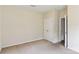 Bedroom featuring neutral walls, carpet flooring, and a door to another room at 9391 Leyton Dr, Harrisburg, NC 28075