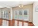 Dining area with chandelier, hardwood flooring, and lots of natural light at 9391 Leyton Dr, Harrisburg, NC 28075