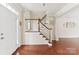 Welcoming foyer with hardwood floors and a staircase at 9391 Leyton Dr, Harrisburg, NC 28075