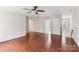 Spacious living room with hardwood floors, natural light, and a ceiling fan at 9391 Leyton Dr, Harrisburg, NC 28075