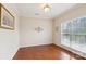 Empty living area with large window providing lots of natural light at 9391 Leyton Dr, Harrisburg, NC 28075