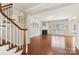 Spacious living room featuring hardwood floors, a fireplace, and ample natural light at 9391 Leyton Dr, Harrisburg, NC 28075