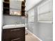 Bright bathroom with modern vanity, sleek fixtures, and a neutral color scheme at 116 Cottage Grove Ln, Mooresville, NC 28117
