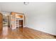 Spacious bedroom with hardwood floors, closet with built-in bed, and large window at 116 Cottage Grove Ln, Mooresville, NC 28117