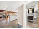 Open-concept hallway showing an adjacent bathroom, kitchen, and living area in a modern home at 116 Cottage Grove Ln, Mooresville, NC 28117